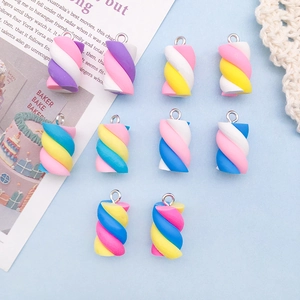 Close-up of colorful resin marshmallow pendants with metal loops for DIY crafts