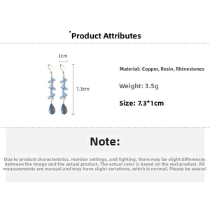 Detailed view of light blue butterfly drop earrings with size measurements in centimeters