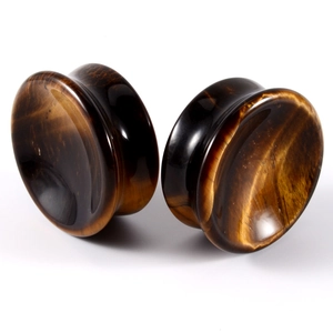 Tiger eye stone ear gauges with smooth polished finish and natural brown texture