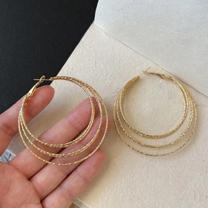 Chic multi-layer geometric round gold hoop earrings with textured finish and three-tier design