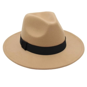 Detailed view of a camel wide brim fedora hat with a black ribbon band on a white base