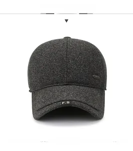 Detailed view of dark grey winter baseball cap featuring wool fabric and metal buckle