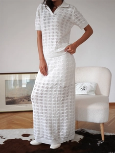 Elegant ivory white knit two-piece set featuring a hollow crochet polo shirt and maxi skirt