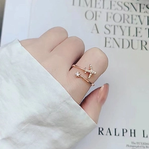 Elegant rose gold airplane ring with shimmering crystal on a stylish model hand