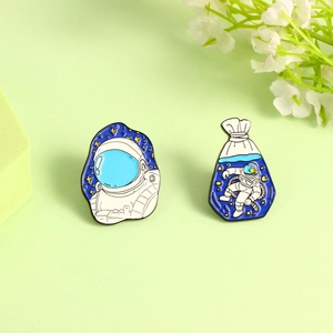 Enamel spaceman lapel pin set featuring astronaut head and creative astronaut in water bag