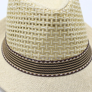 Macro shot of breathable straw weave texture with striped ribbon and detailed stitching
