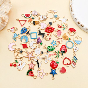 Macro shot of colorful enamel alloy charms for DIY jewelry making in various shapes