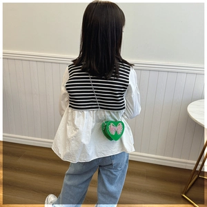 Green heart-shaped kids crossbody bag with pink butterfly and silver chain strap