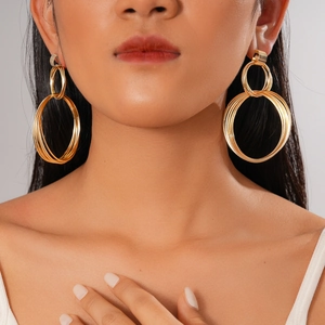 Exaggerated golden multi-layer geometric round cross earrings for a trendy metallic look