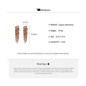 Detailed size specifications for geometric tassel earrings with pink rhinestones