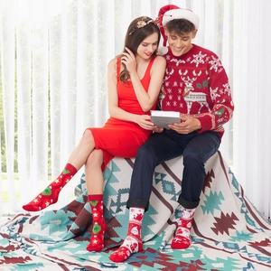 Cozy Christmas themed cotton socks featuring Santa and reindeer prints for a festive look