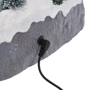Macro view of the DC power interface and black cable for the LED Christmas snow house