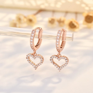 Rose gold heart pendant earrings with cubic zirconia pavé and hollow geometric design