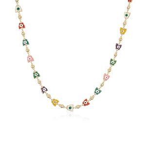 Close-up of gold chain featuring colorful enamel butterfly pendants with bead accents