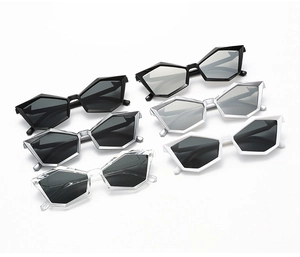 Detailed row of geometric polygonal sunglasses in black, white, silver and clear frames