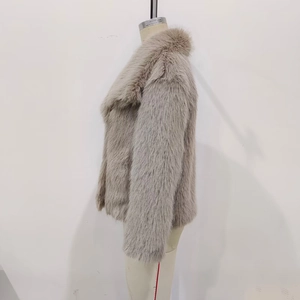 Detail of soft faux fur texture and wide lapel collar on this elegant beige coat