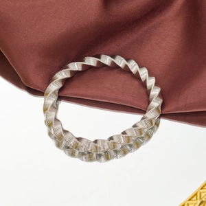 Polished silver stainless steel twisted cable bangle bracelet with spiral texture design