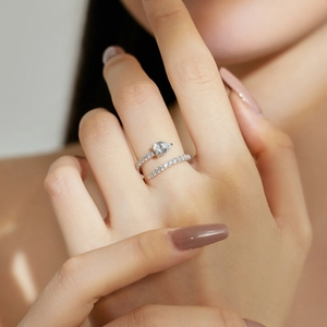 Close-up of S925 sterling silver ring with water-drop diamond and pavé zircon stones
