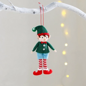 Handmade Christmas elf tree ornaments in festive red and green hanging on white branches