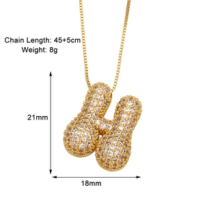 Macro shot of 21x18mm letter H gold necklace pendant with dimensions and box chain length