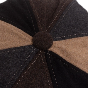 Classic patchwork wool newsboy cap with multi-color panels and top button detail