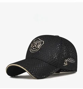Detail of black breathable mesh baseball cap with gold shield embroidery and khaki brim