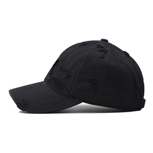 Distressed black cotton baseball cap with ripped details and vintage washed finish