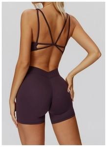 Close-up of strappy criss-cross open back yoga bra and high waist V-cut fitness shorts
