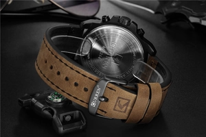 Close-up of CURREN 8314 watch with stainless steel case back and brown leather strap