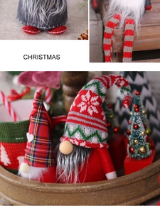Close-up of handmade Christmas gnomes with knit hats and faux fur beards in gold tray