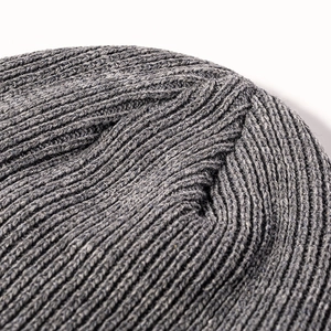 Gray chunky knit beanie hat for men and women featuring warm ribbed texture and top stitching