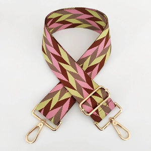 Adjustable chevron nylon bag strap with gold metal hooks on a white background