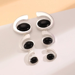 Elegant silver spiral earrings featuring oval black stone inlays for daily wear