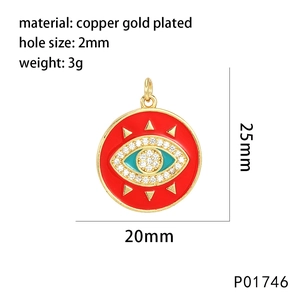 Detailed view of red enamel evil eye pendant with gold plating and cubic zirconia