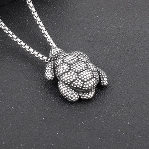 Vintage silver turtle pendant in stainless steel with dot flower patterns on box chain