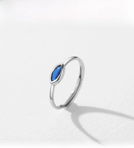 Detailed close-up of a S925 sterling silver evil eye ring with marquise blue stone