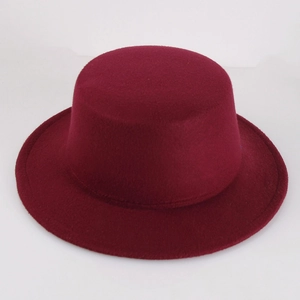 Detailed texture of burgundy wool felt boater hat with flat brim and vintage design