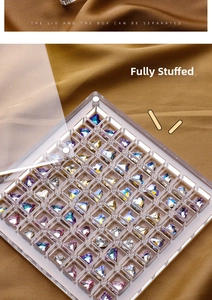 Macro view of clear acrylic organizer filled with colorful heart crystals and detachable lid