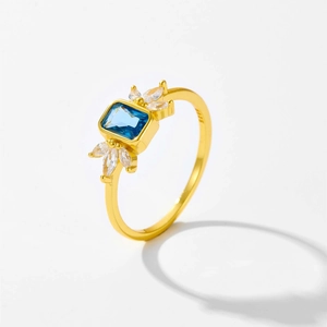 Macro shot of S925 sterling silver ring with blue pear-cut stone and hallmark