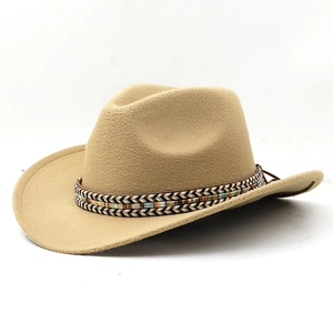 Detail of western cowboy hat featuring colorful ethnic woven band and beige felt texture