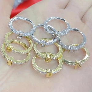 18K gold plated minimalist rings featuring micro-pave zircon letters on palm