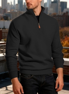 Detail of men's black corduroy sweatshirt with quarter-zip and ribbed texture fabric