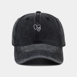 Classic washed black denim baseball cap with white heart embroidery in minimalist style