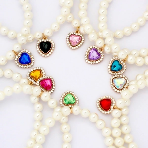 Elegant pearl pet necklaces featuring crystal heart pendants in various vibrant colors