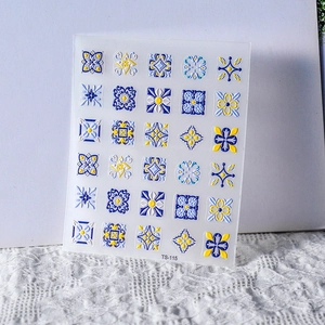 Macro detail of Bohemian style embossed nail stickers with geometric patterns TS-115