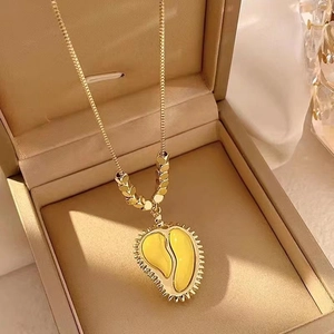 Luxury gold durian pendant necklace with yellow enamel in a beige gift box