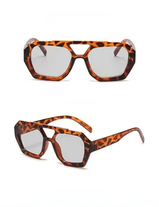 Detail view of retro leopard print double bridge sunglasses with light grey lenses