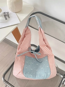 Pink plaid canvas handbag with blue bow accent and large front pocket in Korean style