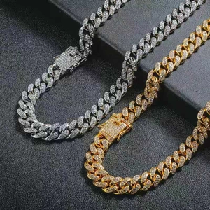 Close-up of hip hop Cuban chain necklaces in gold and silver finish with pavé rhinestones