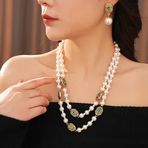 Vintage double layer pearl necklace set with emerald green stones and gold accents